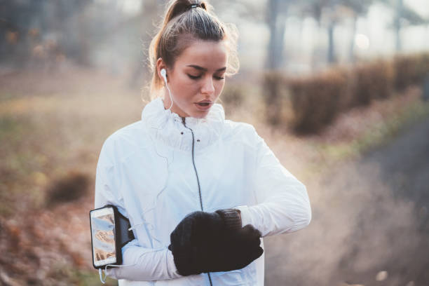 istock Sportswoman checking pulse after sports activity 1067833730