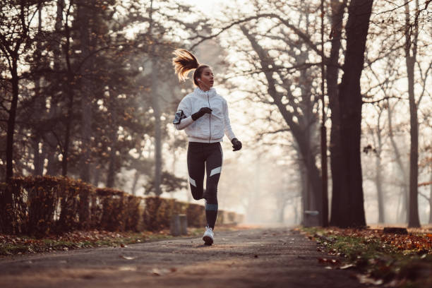 istock Woman jogging during winter morning 1067834494