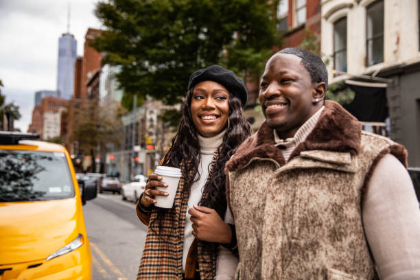 istock Millennial couple walking in Soho - New York 1067835740