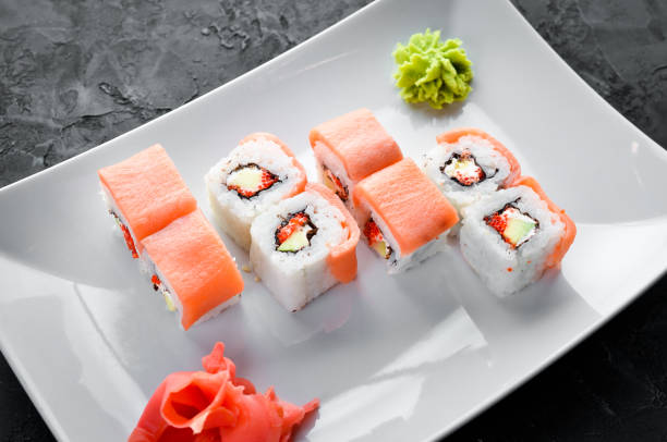 istock Sushi roll with seafood. Top view. On a white wooden background. 1067837498
