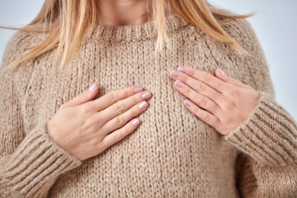 istock Young woman with heart problem holding chest. 1067839568