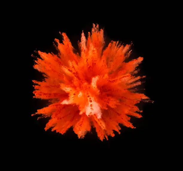Explosion of yellow powder isolated on black background. Abstract colored background