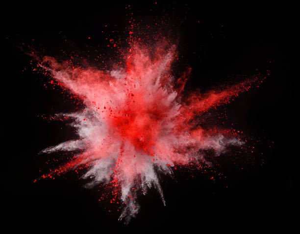 istock Explosion of yellow powder on black background 1067840758