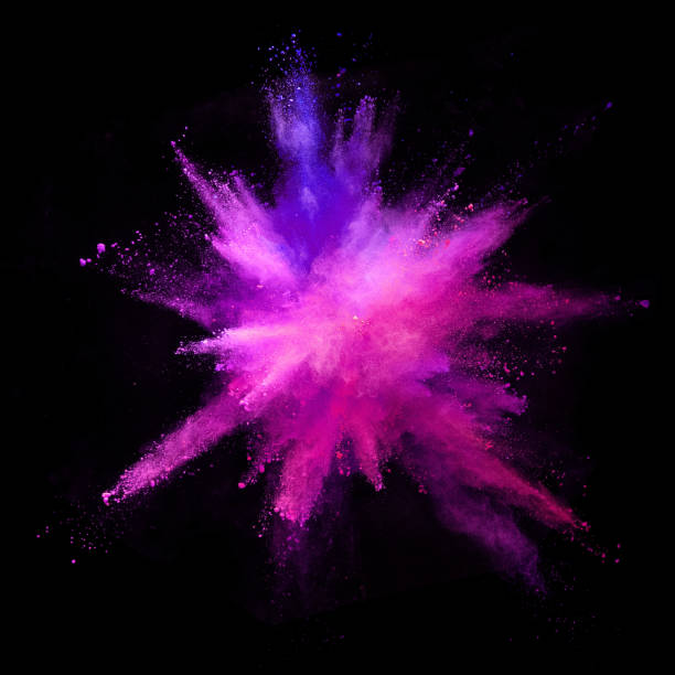 istock Explosion of coloured powder isolated on black background. 1067841594