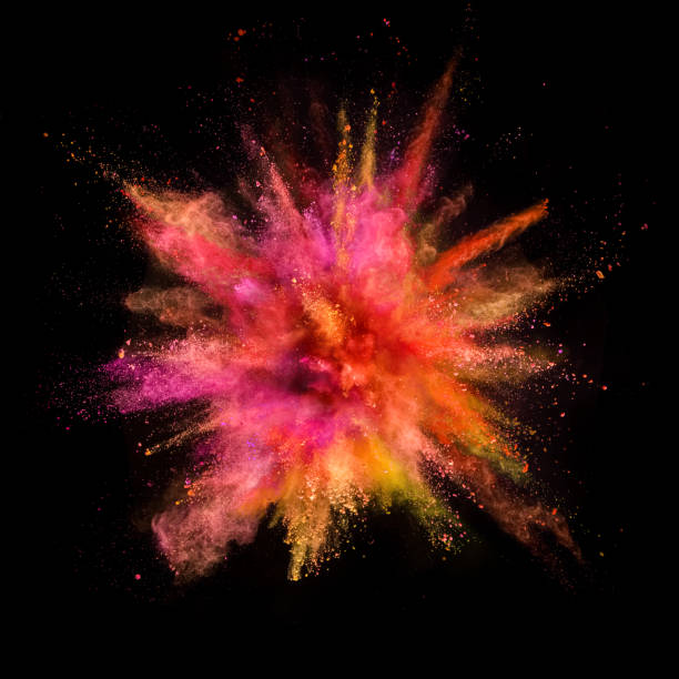 istock Explosion of coloured powder isolated on black background. 1067842674
