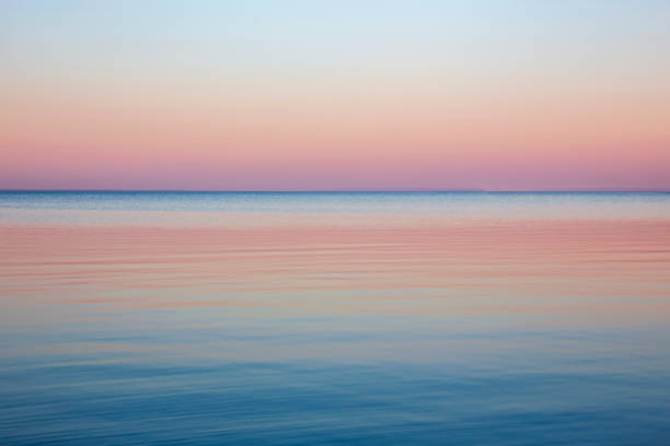 Sunset over sea or lake stock photo