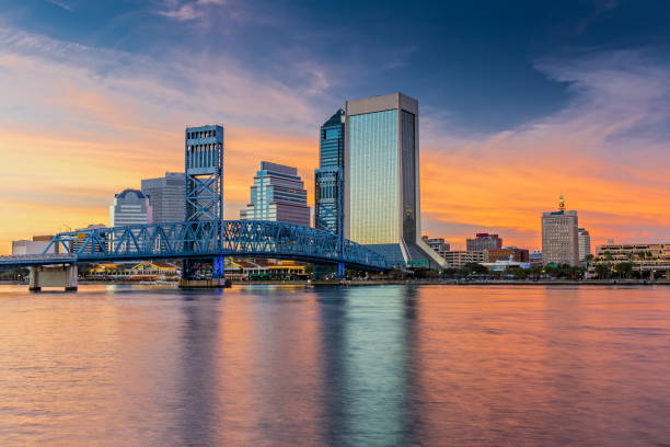 Skyline of Jacksonville, FL and Main Street Bridge at Sunset The Skyline of Jacksonville with beautiful Reflections in the Water jacksonville symbol stock pictures, royalty-free photos & images
