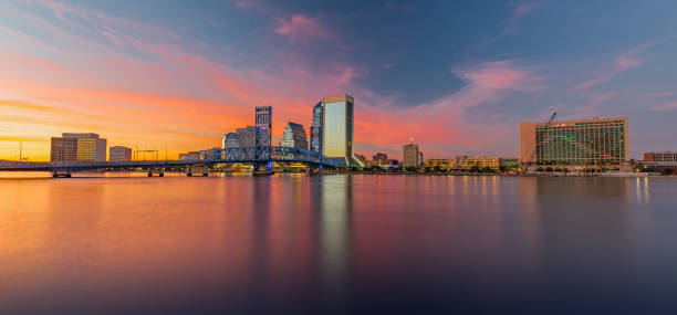 Skyline of Jacksonville, FL and Main Street Bridge at Sunset The Skyline of Jacksonville with beautiful Reflections in the Water jacksonville symbol stock pictures, royalty-free photos & images
