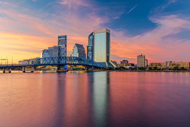 Skyline of Jacksonville, FL and Main Street Bridge at Sunset The Skyline of Jacksonville with beautiful Reflections in the Water jacksonville symbol stock pictures, royalty-free photos & images