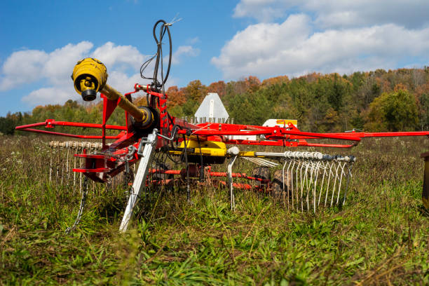 istock Agricultural windrow machine in a farm pasture 1067852378
