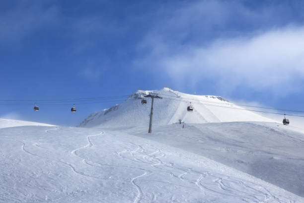istock Gondola lift and off-piste ski slope 1067854302