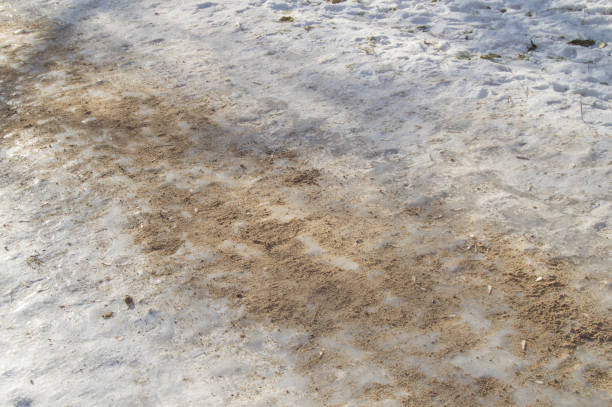 istock Ice track, sanded, removes ice, slippery road, close-up 1067855428