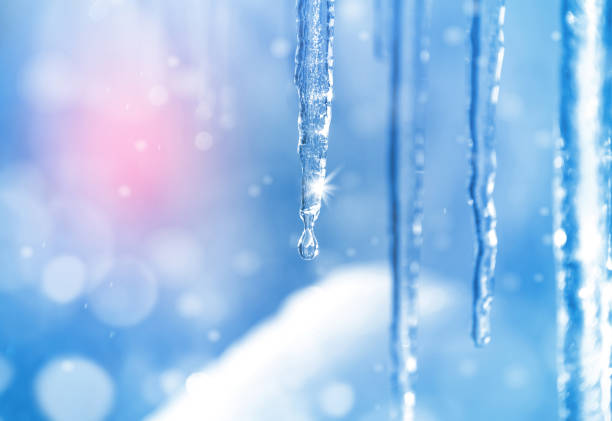 Spring dripping Background of bright transparent icicles in the sunlight icicles melting stock pictures, royalty-free photos & images