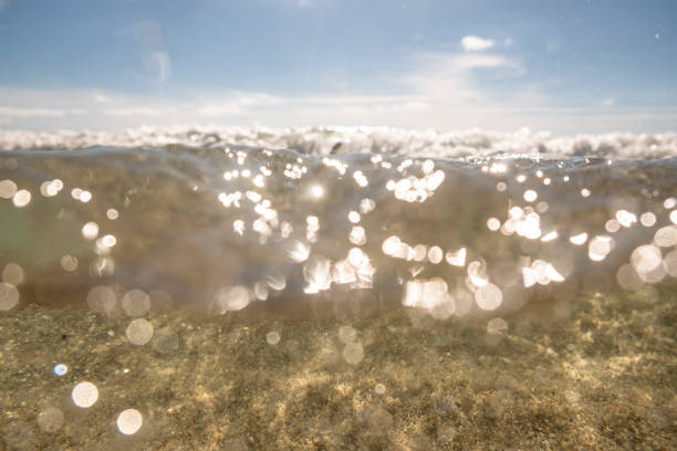 Porthcurno Beach, Cornwall sea surface in bright Autumn sunshine.