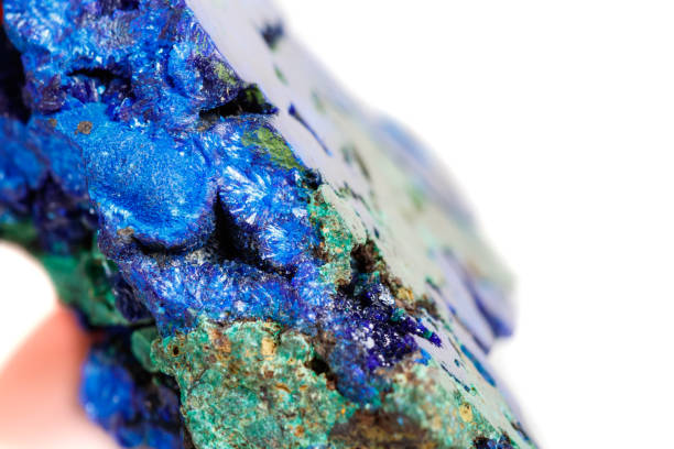 istock Macro mineral stone malachite with azurite on white background 1067858978
