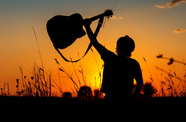 istock Silhouette of a Musician 1067861074