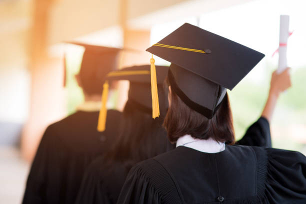 istock Black graduates wear black suits on graduation day at university. 1067864682