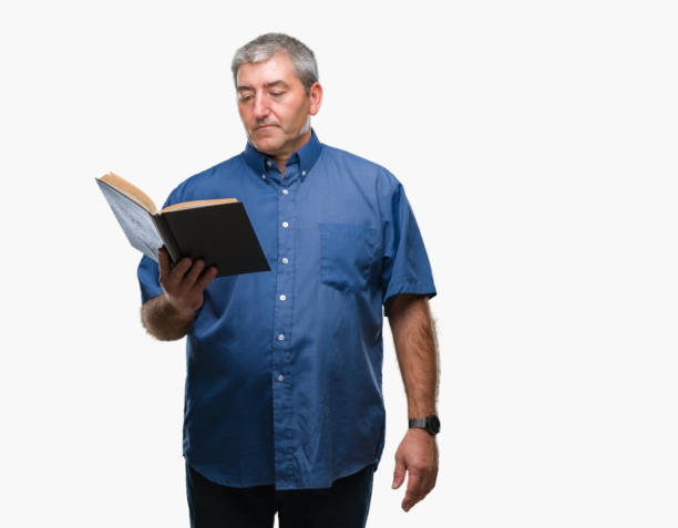 istock Handsome senior teacher man reading a book over isolated background with a confident expression on smart face thinking serious 1067865424