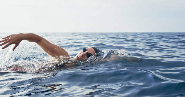 istock Open water swimmer swimming in sea 1067877368