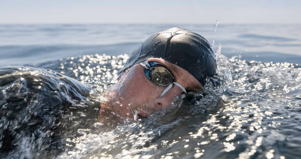 istock Open water swimmer swimming in sea 1067877370