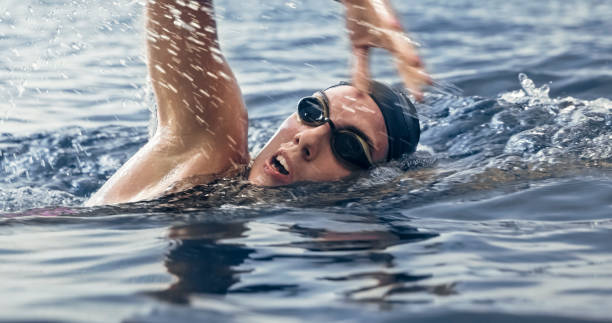 istock Open water swimmer swimming in sea 1067877378