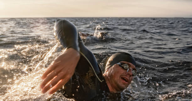 istock Open water swimmer swimming in sea 1067877420