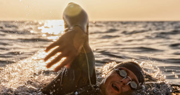 istock Open water swimmer swimming in sea 1067877428