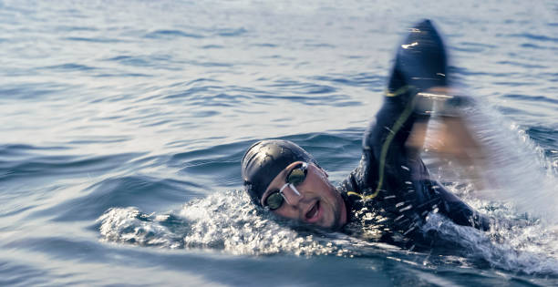 istock Open water swimmer swimming in sea 1067877442