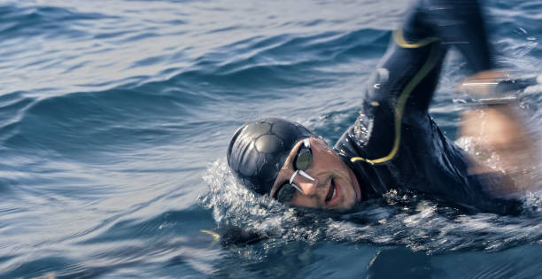 istock Open water swimmer swimming in sea 1067877444