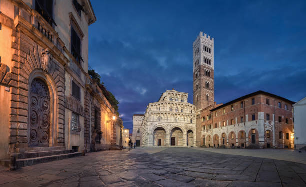 Piazza San Martino and Lucca Cathedral at dusk Lucca, Italy. Panorama of Piazza San Martino square with Lucca Cathedral at dusk lucca stock pictures, royalty-free photos & images