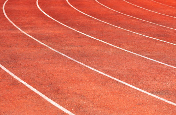 istock Stadium track for running and athletics competitions. New synthetic rubber treadmill. Empty racetrack. 1067878086