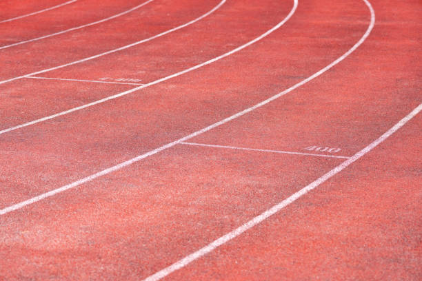 istock Stadium track for running and athletics competitions. New synthetic rubber treadmill. Empty racetrack. 1067878122