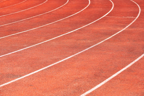 istock Stadium track for running and athletics competitions. New synthetic rubber treadmill. Empty racetrack. 1067878136