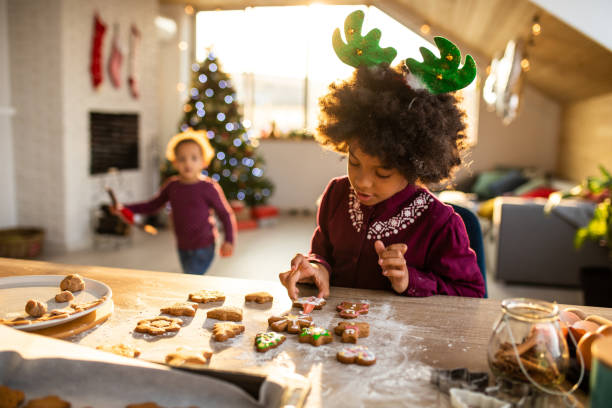 istock Girl decorating Gingerbread cookies 1067879378