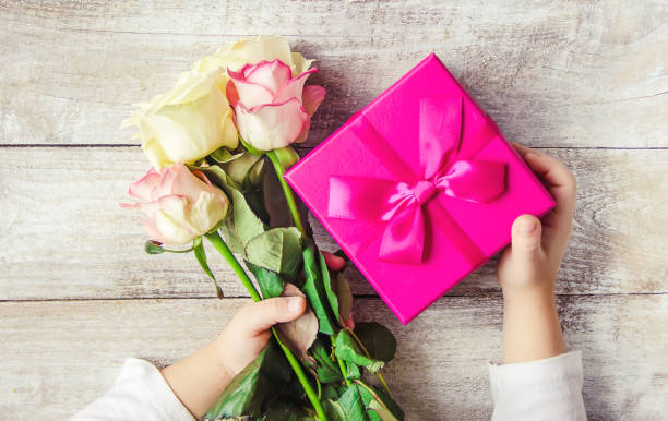 istock gift and flowers. selective focus. holideys and events. 1067880076