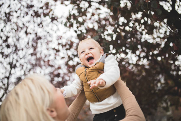 istock Mother and her son are playing in the park 1067880804