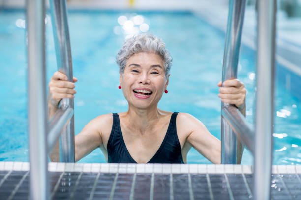istock Senior Woman In Pool 1067881118