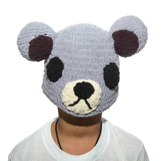 istock The boy put a knit hat on his face. 1067889322