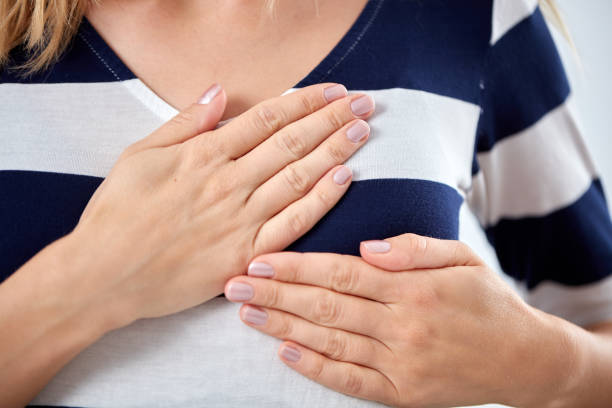 istock Young woman with heart problem holding chest. 1067889512