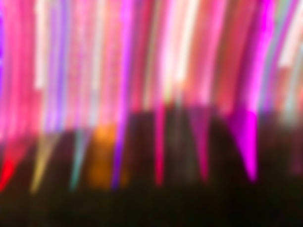 istock Fountain flashes, lit by colored lights at night. Abstract background in different shades of colors. 1067891586