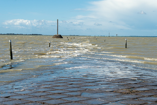 The road called the Passage Du Gois to go to the island of Noirmoutier, France being covered by high tide