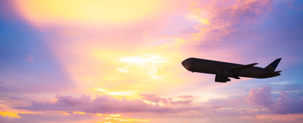istock silhouette airplane on sunset sky 1067894148