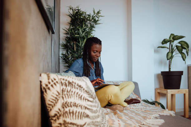 istock African woman Relaxing from work in lounge area in modern office 1067895210