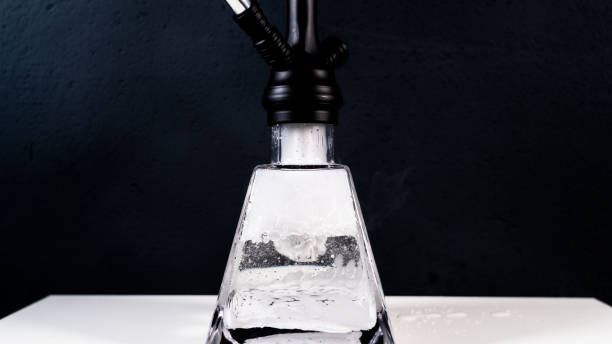 istock hookah close up shot with black background, smoke inside a hookah 1067900806