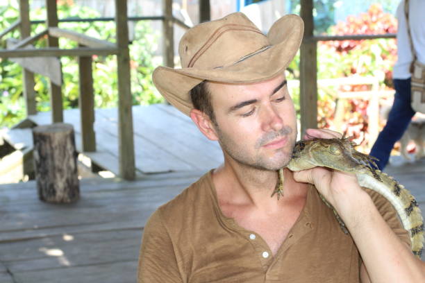 istock Man holding baby reptile with copy space 1067907218