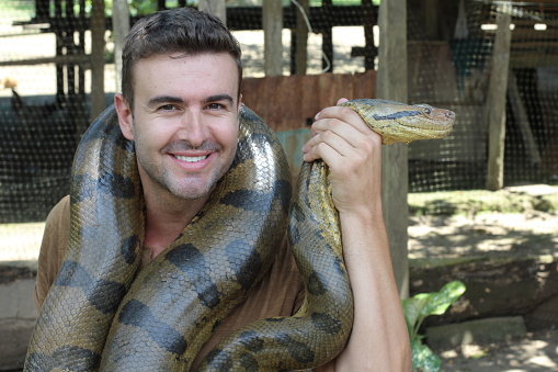 Man loving his gorgeous Anaconda.