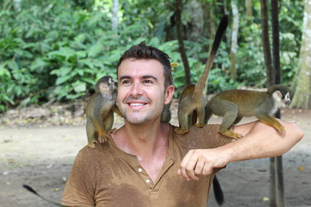 istock Having fun with a group of monkeys 1067907306