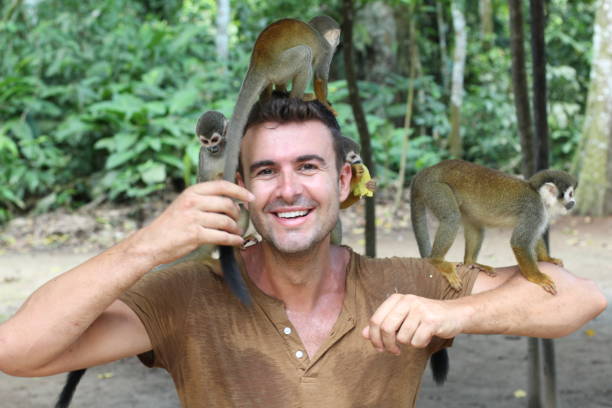 istock Having fun with a group of monkeys 1067907308
