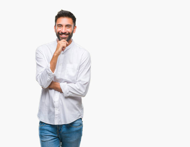 istock Adult hispanic man over isolated background looking confident at the camera with smile with crossed arms and hand raised on chin. Thinking positive. 1067907856