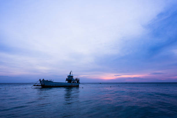 istock a ship on the sea in the sunrise 1067910410